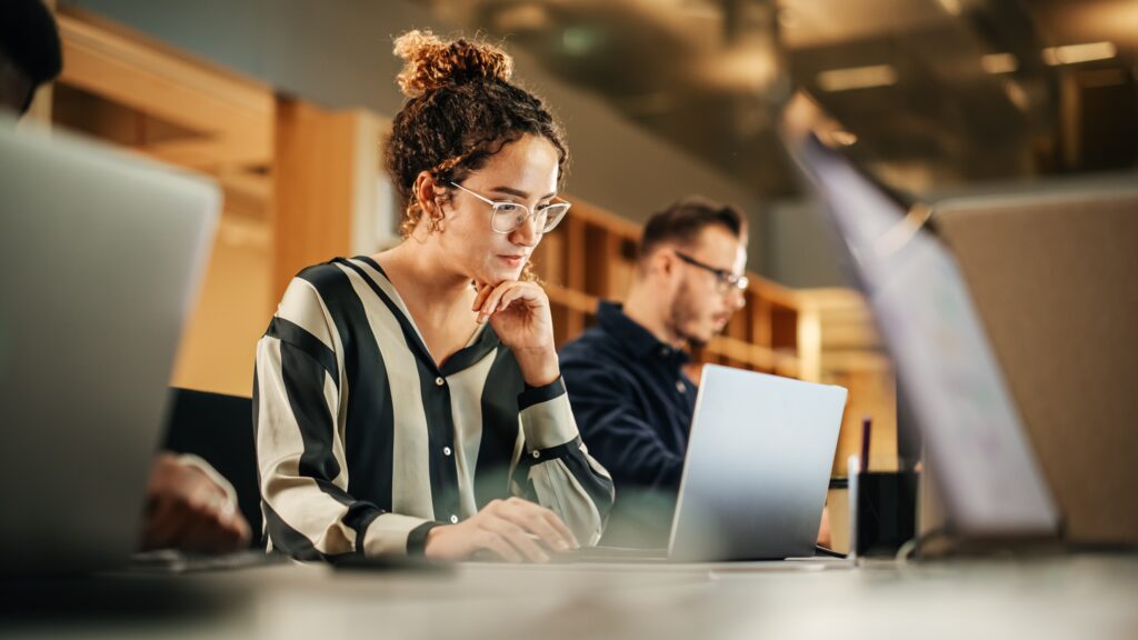 Woman working on lead management on her laptop